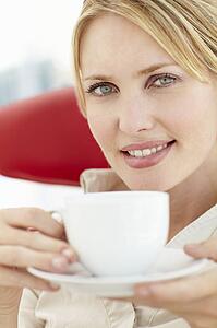 Woman relaxing with cup of tea