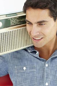 Young man listening to radio