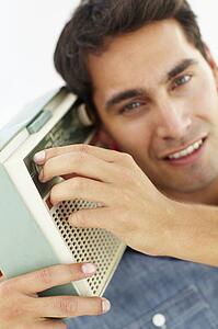 Young man listening to radio