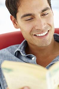 Young man reading a book