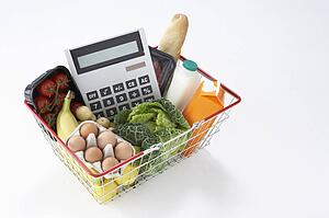 Basket of groceries and calculator