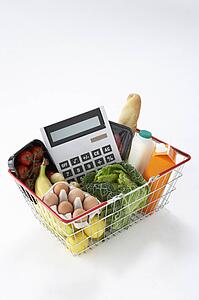 Basket of groceries and calculator