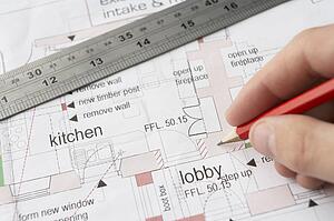 Man working on technical drawing
