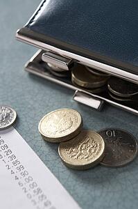 Open purse with till receipt and coins