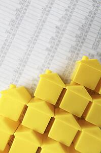 Little plastic houses on a spreadsheet