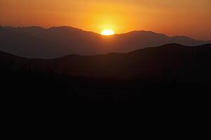Sunset Over The Mountains Of The Mojave Desert National Preserve; Baker, California, United States Of America