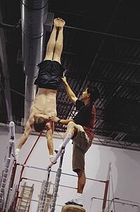 Coast Assisting An Athlete With Parallel Bars