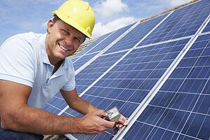 Man installing solar panels