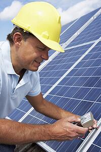 Man installing solar panels