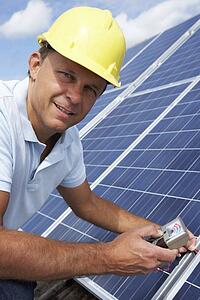 Man installing solar panels