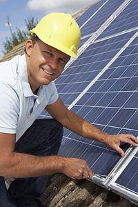 Man installing solar panels