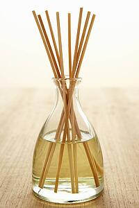 Incense sticks in carafe of water