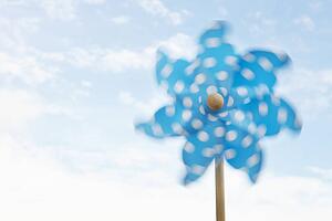 Child's plastic windmill turning in wind