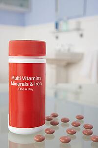 Vitamin pills on bathroom shelf