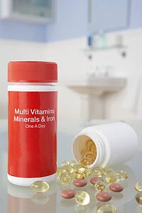 Vitamin pills on bathroom shelf