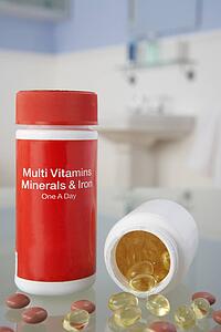 Vitamin pills on bathroom shelf
