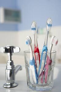 Toothbrushes in bathroom