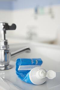 Almost empty toothpaste tube