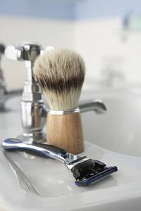 Man's shaving kit in bathroom