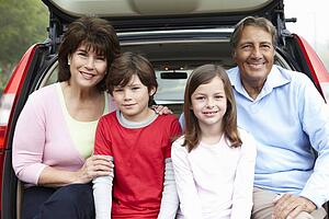 Hispanic grandparents and grandchildren outdoors