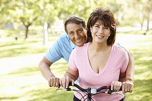 Senior Hispanic couple with bike
