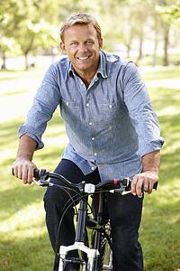 Man riding bike in park