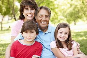 Hispanic grandparents and grandchildren outdoors