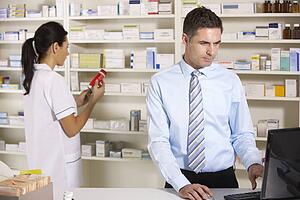 UK nurse and pharmacist working in pharmacy