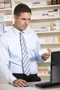 UK pharmacist working on computer