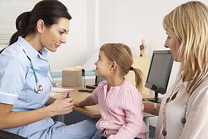 British nurse about to inject young child