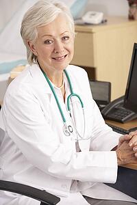 American female doctor sitting at desk