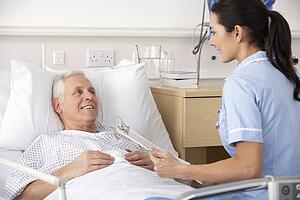 Nurse and male patient in UK Accident and Emergency