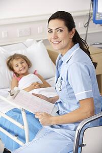 Nurse with child patient in UK Accident and Emergency
