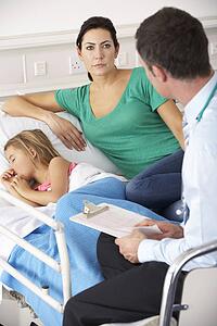 UK Accident and Emergency doctor with mother and child