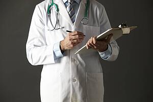 American doctor with clipboard and stethoscope