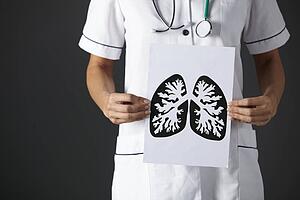 American nurse holding ink drawing lungs