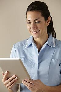UK nurse using computer tablet