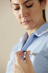 UK nurse looking at watch