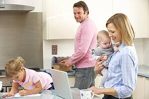 Family busy together in kitchen