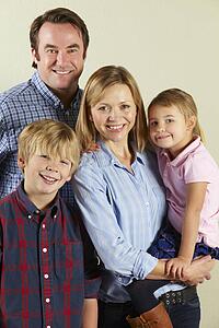 Studio Shot Of Relaxed Family