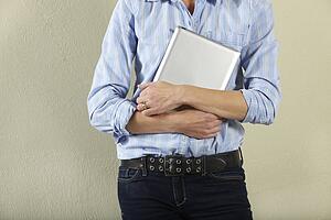 Cropped Shot Of Middle Aged Woman Holding Tablet Computer