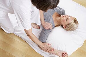 Woman having Shiatsu massage