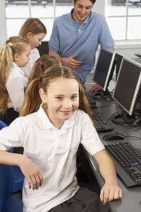 Girl in school class smiling to camera