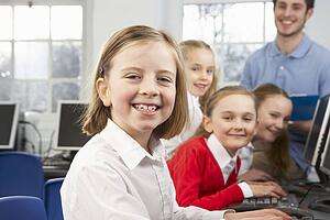 Girls and teacher in school class