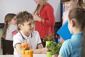 Children learning about plants in school class