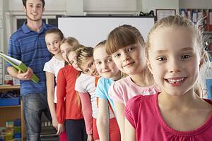 Teacher with line up of children in class