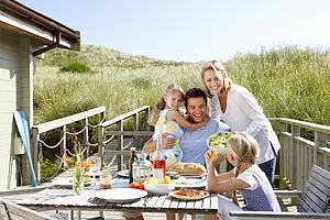 Family on vacation eating outdoors