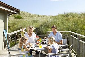 Family on vacation eating outdoors