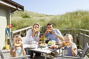 Family on vacation eating outdoors
