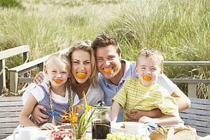 Family on vacation eating outdoors